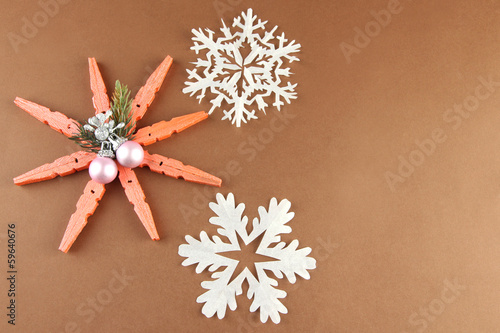 Photo: Beautiful snowflakes on brown background Beautiful snowflakes on brown background