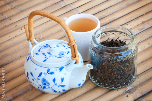 Photo: Asian tea drink and vintage tea pot. Asian tea drink and vintage tea pot.