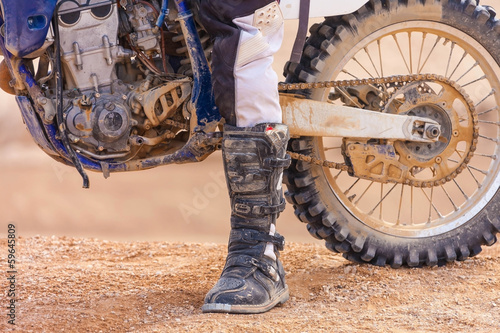 Photo: racer on a motorcycle in the desert racer on a motorcycle in the desert