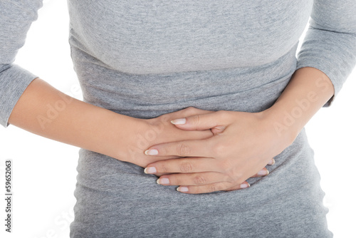 Photo: Young casual girl woman is having stomach ache. Young casual girl woman is having stomach ache.