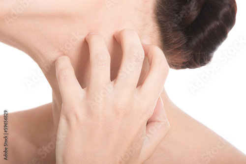 Photo: Young beautiful topless woman is scratching her neck. Young beautiful topless woman is scratching her neck.