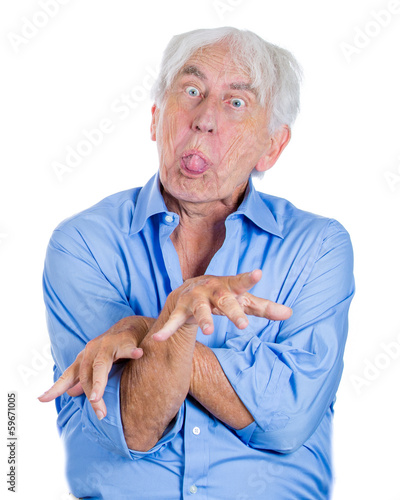 Photo: Crazy, agitated, unhinged, old man sticking tongue out Crazy, agitated, unhinged, old man sticking tongue out