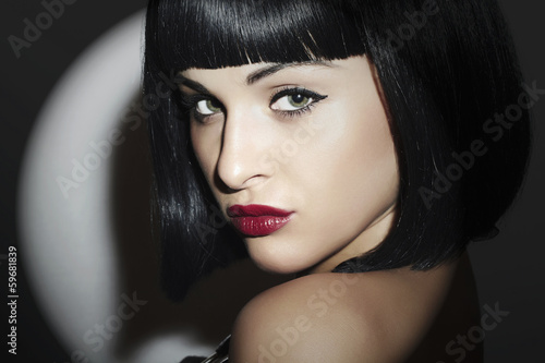 Photo: Beautiful Brunette Woman. Retro style.Black Hair. red lips Beautiful Brunette Woman. Retro style.Black Hair. red lips