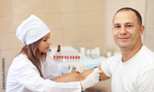 Photo: nurse pricked blood from patient nurse pricked blood from patient