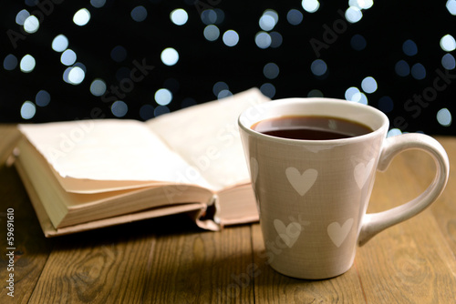 Photo: Composition of book with cup of coffee Composition of book with cup of coffee