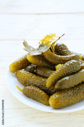 Photo: pickled gherkins on a plate pickled gherkins on a plate