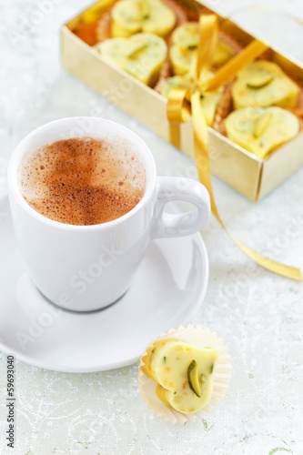 Photo: Homemade white chocolate candy heart, cup of hot coffee Homemade white chocolate candy heart, cup of hot coffee