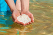 Female hands with sea salt from Dead Sea Female hands with sea salt from Dead Sea