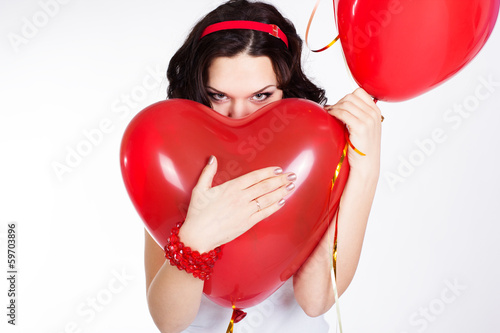 Photo: valentine's day beautiful young woman with red balloons valentine's day beautiful young woman with red balloons