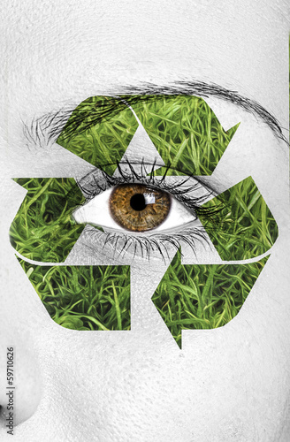 Photo: recycle sign painted on face, eco concept recycle sign painted on face, eco concept
