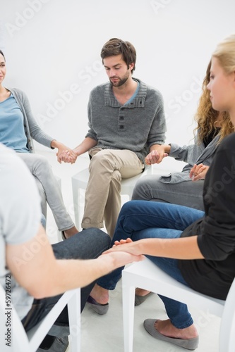 Photo: Group therapy in session sitting in a circle Group therapy in session sitting in a circle