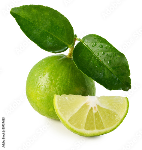 Photo: Lime with leaf on a white background. Lime with leaf on a white background.