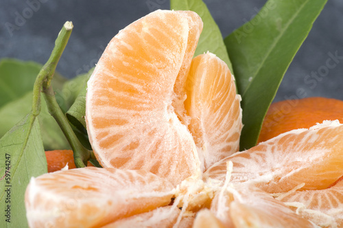 Photo: Orange mandarin or tangerine fruit with leaves Orange mandarin or tangerine fruit with leaves