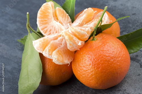 Photo: Orange mandarin or tangerine fruit with leaves Orange mandarin or tangerine fruit with leaves