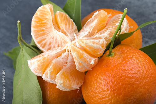 Photo: Orange mandarin or tangerine fruit with leaves Orange mandarin or tangerine fruit with leaves