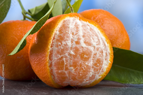 Photo: Orange mandarin or tangerine fruit with leaves Orange mandarin or tangerine fruit with leaves