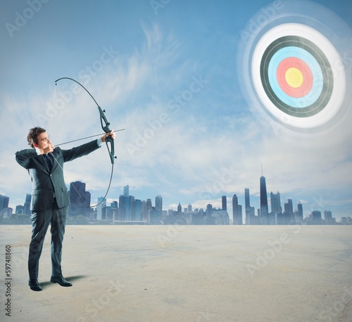 Photo: Businessman with bow and arrow Businessman with bow and arrow