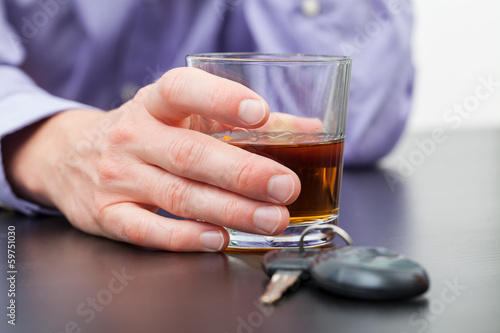 Photo: Driver with glass of whisky Driver with glass of whisky