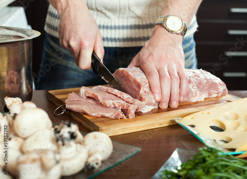 Photo: cutting raw meat cutting raw meat