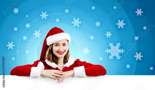 Photo: Santa girl with banner Santa girl with banner