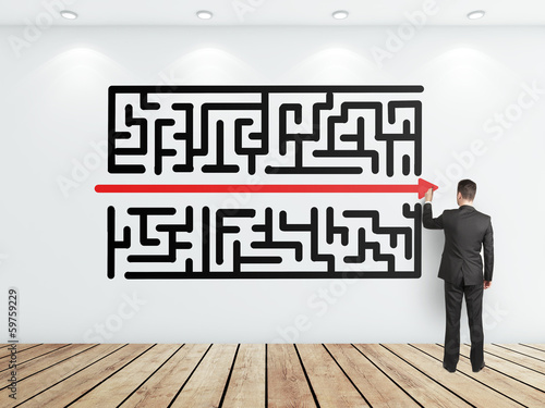 Photo: businessman drawing maze businessman drawing maze