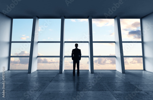 Photo: man standing in office man standing in office