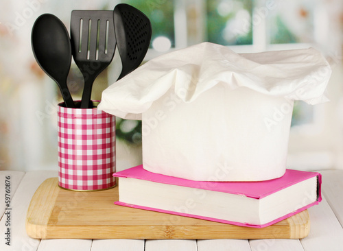 Photo: Chef's hat with spoons and cook book Chef's hat with spoons and cook book