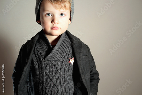 Photo: Fashionable Little Boy in Cap.Kid.Fashion Children.Winter Style Fashionable Little Boy in Cap.Kid.Fashion Children.Winter Style