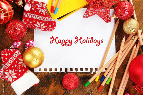 Photo: Letter to Santa Claus on wooden table close-up Letter to Santa Claus on wooden table close-up