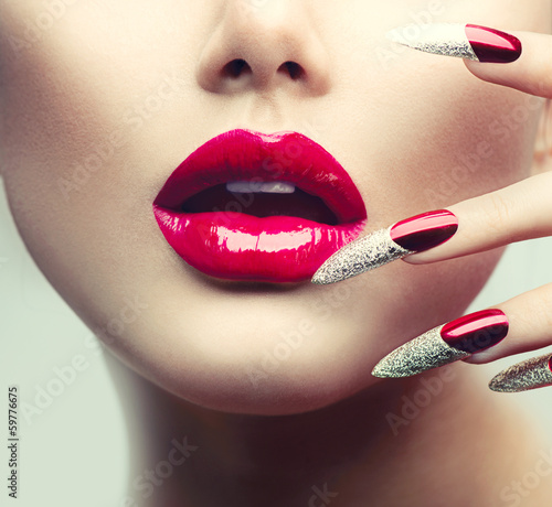 Photo: Makeup and Manicure. Red Long Nails and Red Glossy Lips Makeup and Manicure. Red Long Nails and Red Glossy Lips