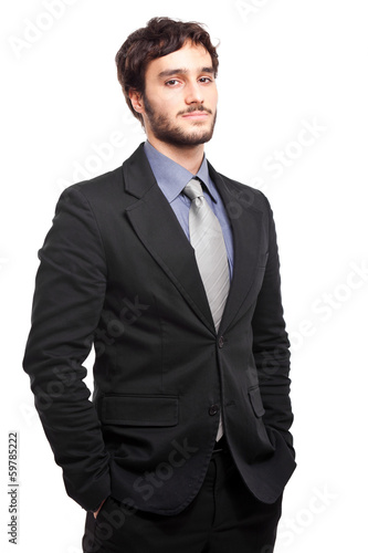 Photo: Confident young businessman isolated on white Confident young businessman isolated on white