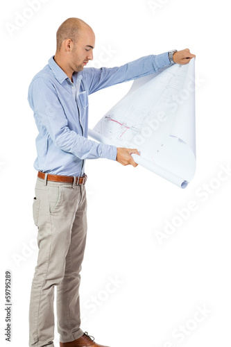 Photo: junger erfolgreicher geschäftsmann mit bauplan blueprint junger erfolgreicher geschäftsmann mit bauplan blueprint