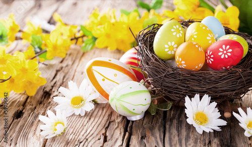 Photo: Easter colored eggs on wood Easter colored eggs on wood