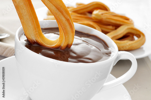 Photo: churros con chocolate, a typical Spanish sweet snack churros con chocolate, a typical Spanish sweet snack