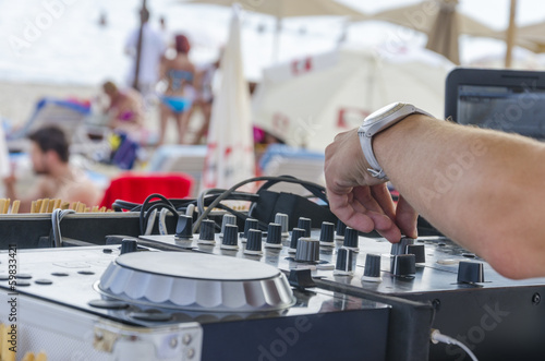 Photo: Beach Dj close-up. Summer beach club Beach Dj close-up. Summer beach club