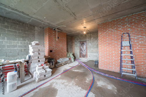 Photo: Room with universal gypsum plaster and others building materials Room with universal gypsum plaster and others building materials