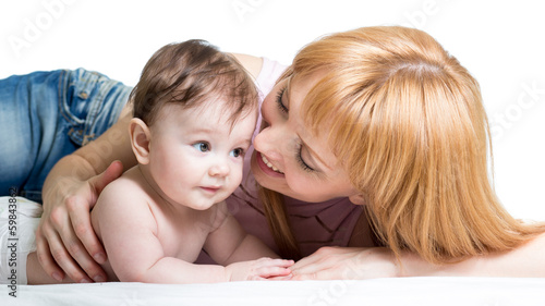 Photo: Mother hugging her baby isolated Mother hugging her baby isolated
