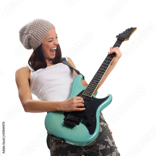 Photo: Beautiful young woman playing a guitar Beautiful young woman playing a guitar