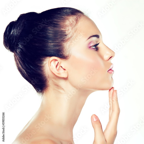 Photo: Beauty Portrait. Beautiful Spa Woman Touching her Face Beauty Portrait. Beautiful Spa Woman Touching her Face