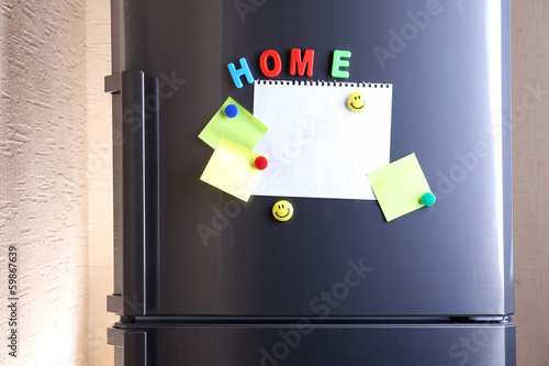 Photo: Empty paper sheets on fridge door Empty paper sheets on fridge door