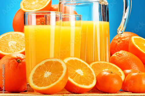 Photo: Composition with glasses of orange juice and fruits Composition with glasses of orange juice and fruits
