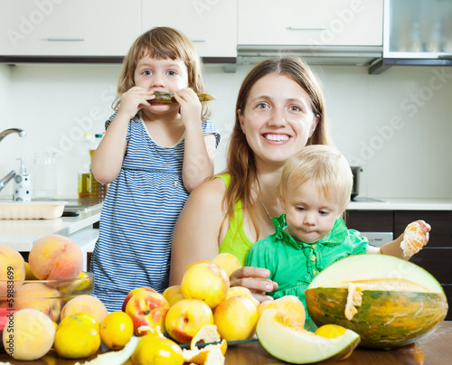 Photo: Happy family together with melon Happy family together with melon