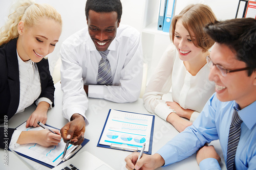 Photo: Business people working together. Business people working together.
