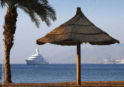 Photo: Sandy beach of Eilat - famous resort city in Israel Sandy beach of Eilat - famous resort city in Israel