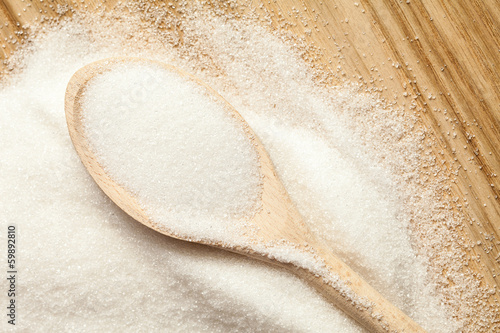 Photo: Spoon in a pile of sugar Spoon in a pile of sugar