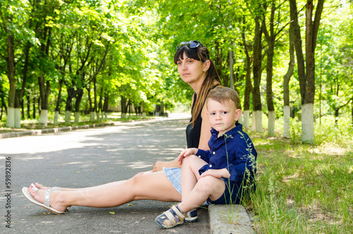 Photo: Mother and son waiting in a rural street Mother and son waiting in a rural street