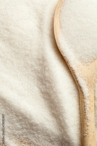 Photo: Spoon in a pile of sugar Spoon in a pile of sugar