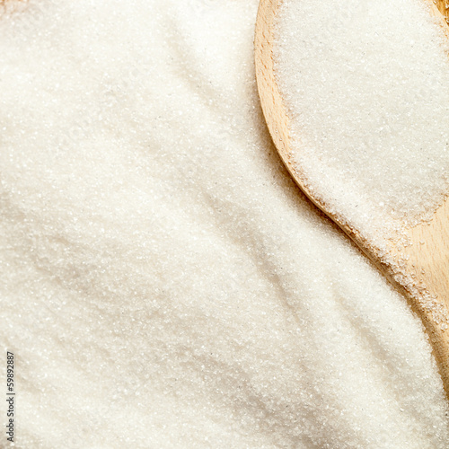 Photo: Spoon in a pile of sugar Spoon in a pile of sugar