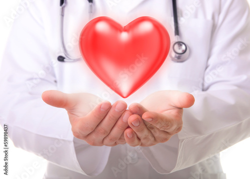 Photo: Male doctor showing a red heart Male doctor showing a red heart