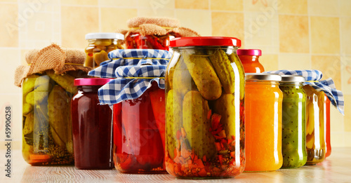 Photo: Jars of marinated food. Pickled vegetables and jams Jars of marinated food. Pickled vegetables and jams